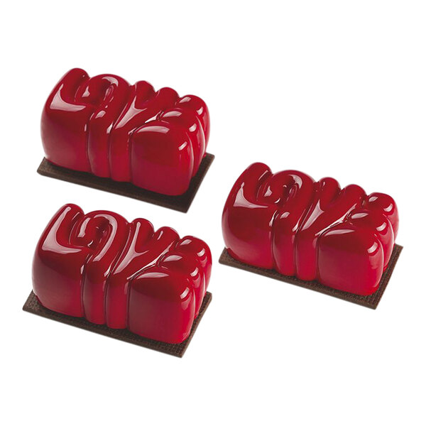 Red heart shaped desserts made using Pavoni Pavoflex silicone mold.