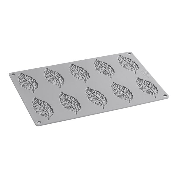 A gray silicone mold with leaf-shaped compartments.