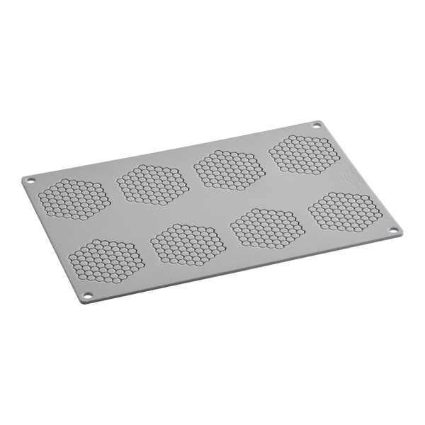 A grey rectangular Pavoni Gourmand silicone baking mold with honeycomb-shaped cavities.