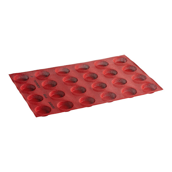 A red Pavoni silicone bread and pastry mold with holes in it.