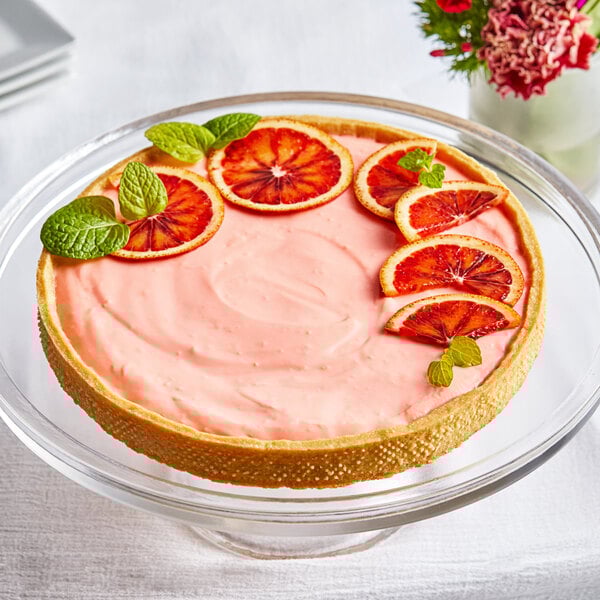 A tart with blood oranges on top in a Pavoni Progetto Crostate tart ring.