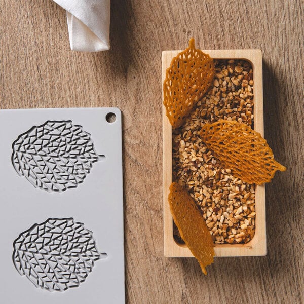 A close up of a Pavoni leaf silicone baking mold.