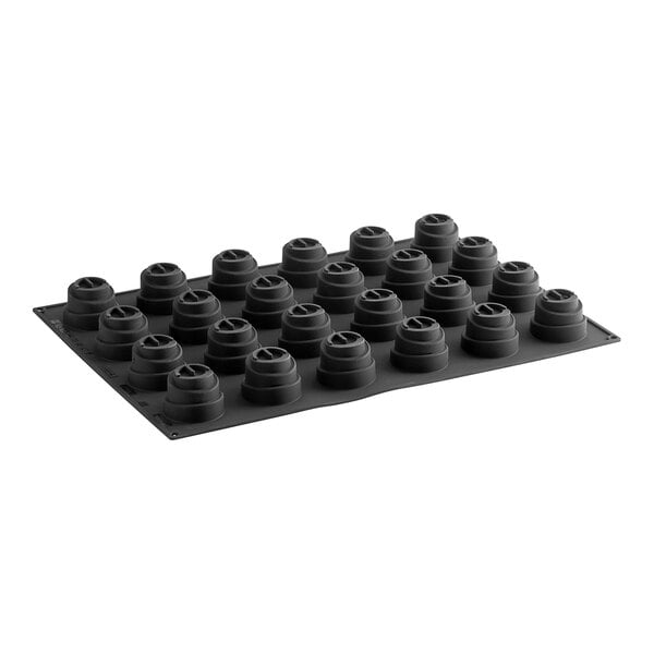 A black silicone mold with 24 compartments, each with a hole in the bottom.