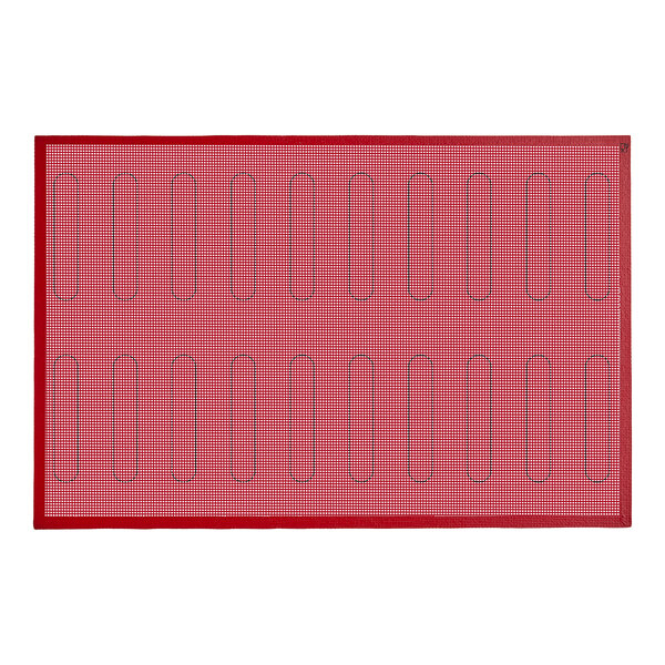 A red silicone baking mat with a grid of black lines.