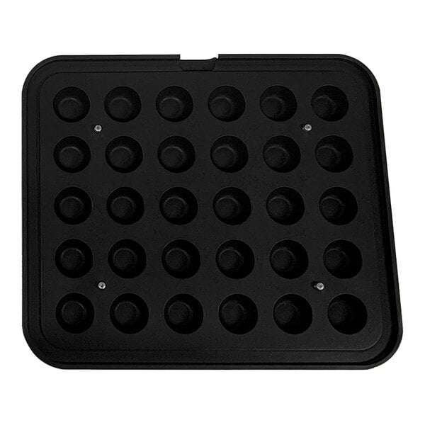 A black Pavoni round insert tray with 30 cavities.