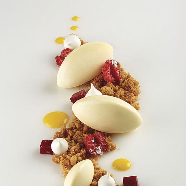 A Pavoni Pavoflex silicone baking mold with quenelle-shaped cavities.