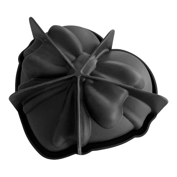 A black silicone heart-shaped baking mold with a bow on top.