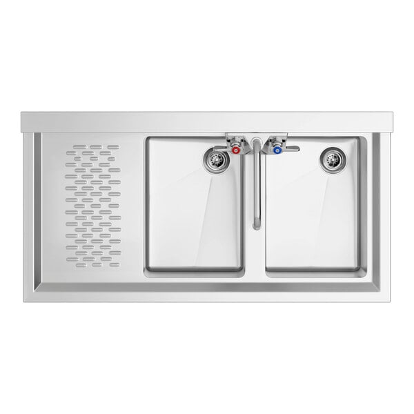 A close-up of a Regency stainless steel underbar sink with two faucets.