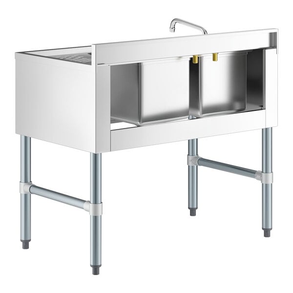 A Regency stainless steel underbar sink with two bowls, a faucet, and a right drainboard.