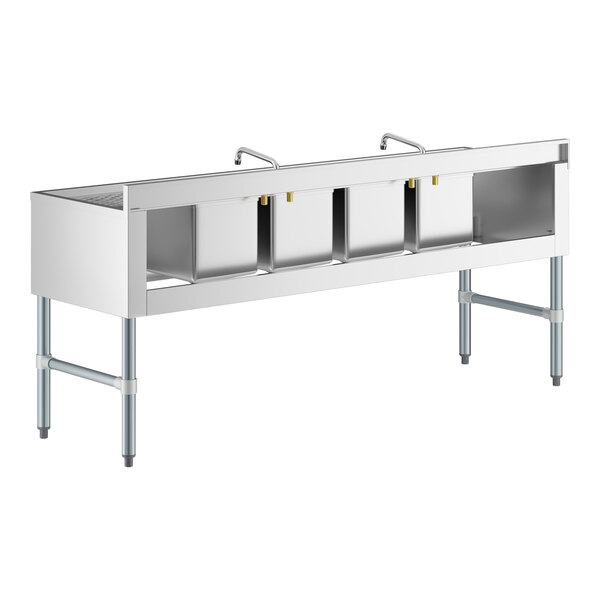 A Regency stainless steel underbar sink with 2 faucets and 2 drainboards.