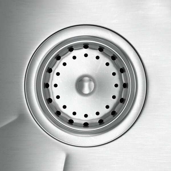 A close-up of a Regency stainless steel drop-in sink with holes for a faucet and a drain.