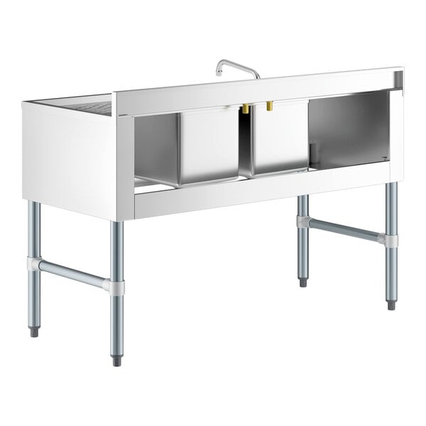 A Regency stainless steel underbar sink with faucet and 2 drainboards over a white counter.