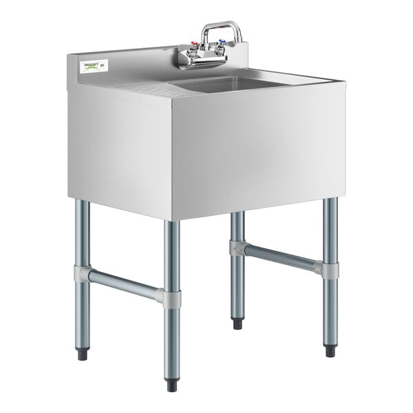 A Regency stainless steel underbar sink with faucet and left drainboard.