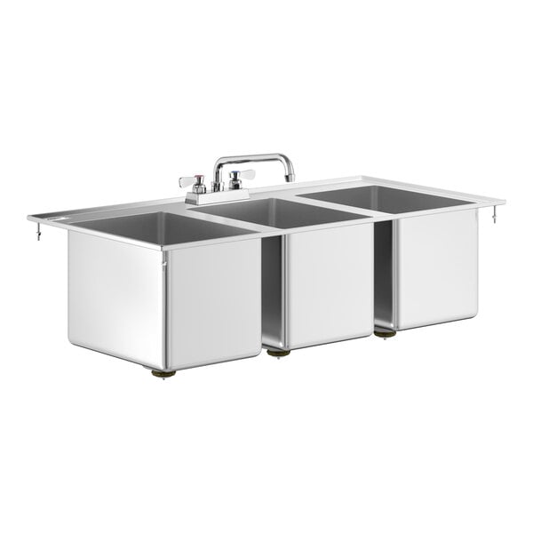 A stainless steel three-compartment drop-in sink with a central faucet and three deep rectangular basins.