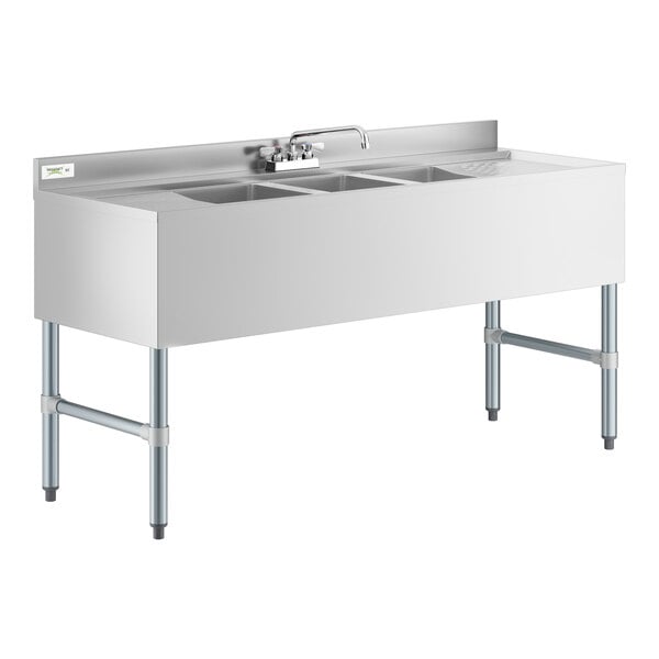 A Regency stainless steel underbar sink with 2 drainboards and a faucet.