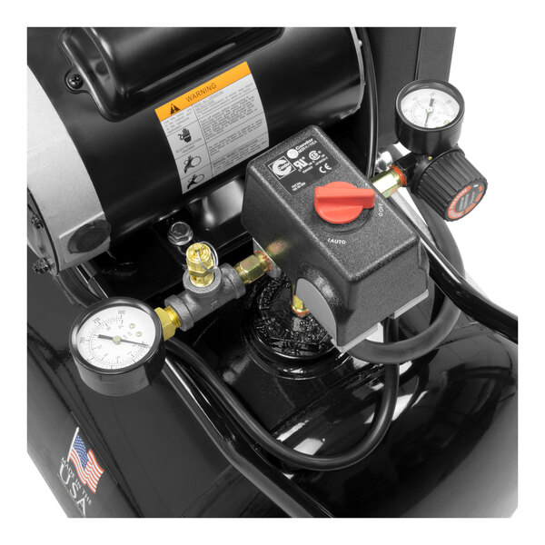 An Industrial Air black portable horizontal air compressor with gauges.