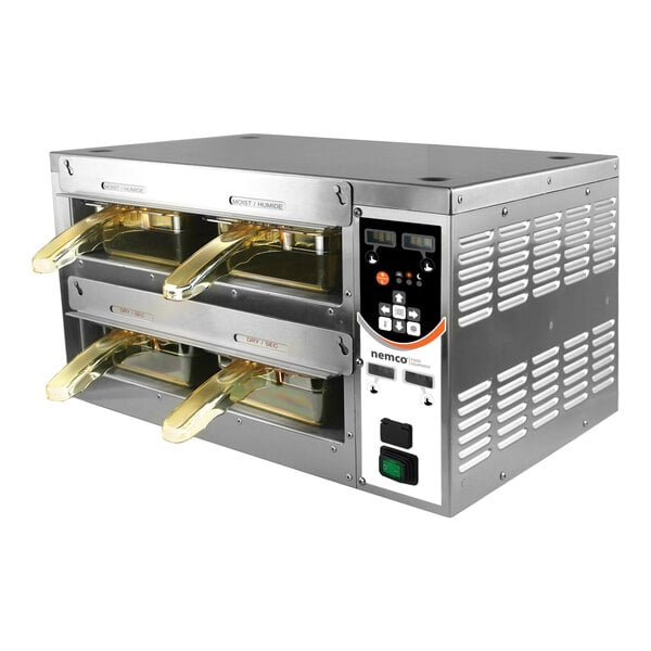 A Nemco food warmer holding two trays of food.