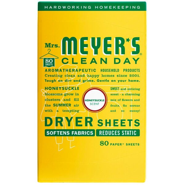 A yellow box of Mrs. Meyer's Clean Day Honeysuckle dryer sheets with white and green text.