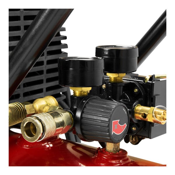 A close up of a red ProForce air compressor with black accents and brass valves.