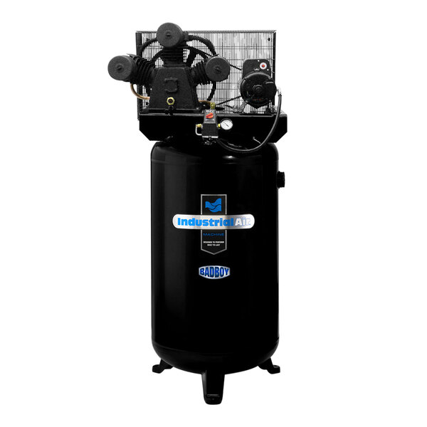 An Industrial Air stationary black air compressor with a cage.