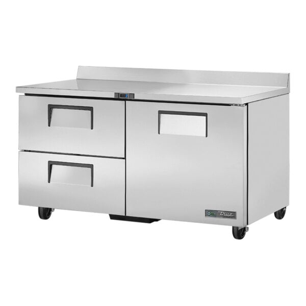 A True worktop refrigerator with two drawers and a door.