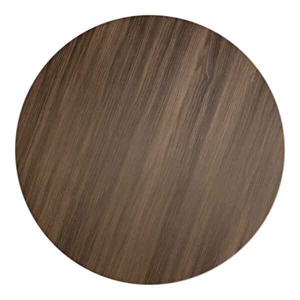 A Lancaster Table & Seating round wood table top with a dark walnut finish.