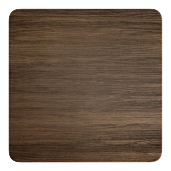 A close up of a Lancaster Table & Seating square wood table top with a dark walnut finish.