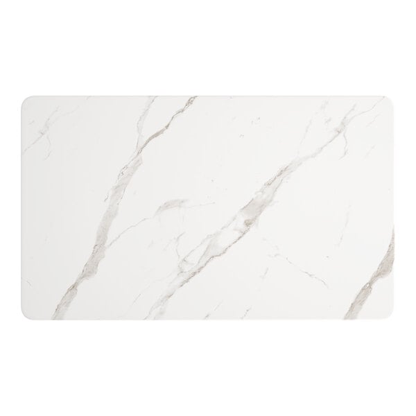 A white rectangular table top with white marble and black veins.