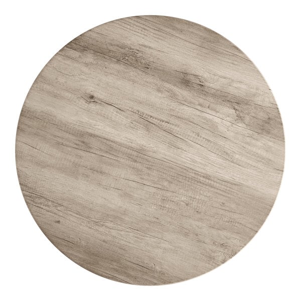 A 42-inch round thermo-formed MDF table top with a gray wood finish.