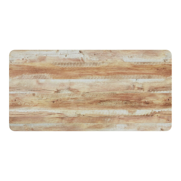 A close-up of a wood surface with a barnwood finish.