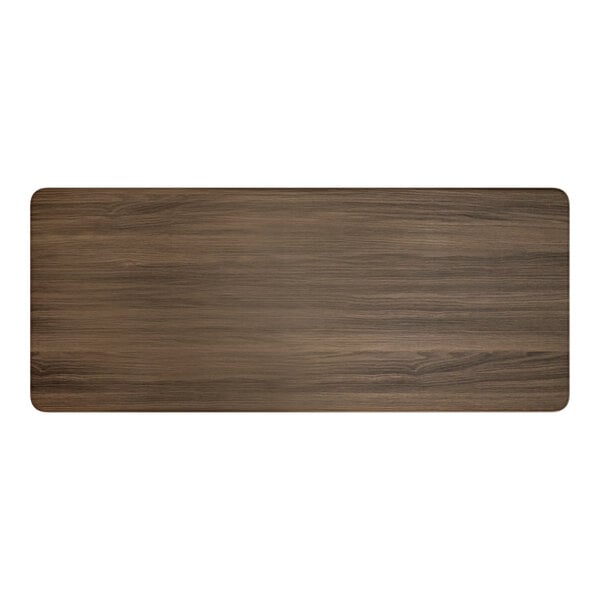 A rectangular wooden surface with a dark brown finish.