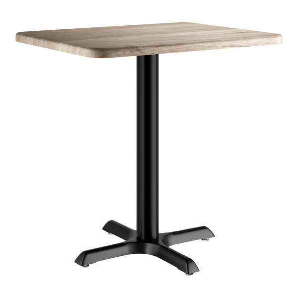 A rectangular standard height table with a gray wood finish top and a black pedestal base.