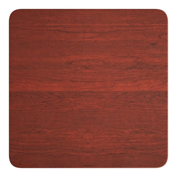 A Lancaster Table & Seating square table top with a red mahogany finish.