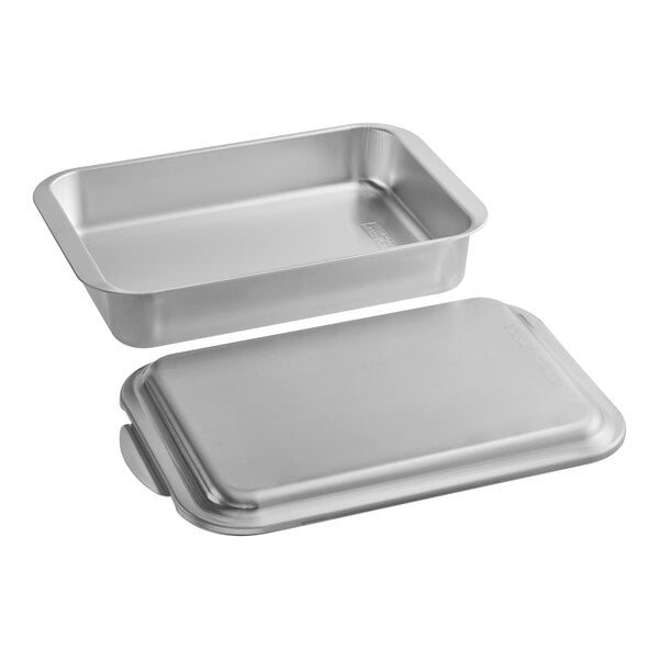 A Nordic Ware rectangular aluminum cake pan with a lid.