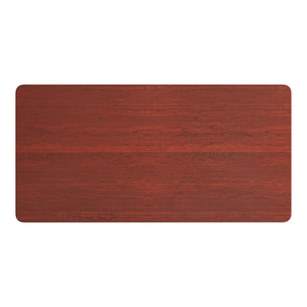 A Lancaster Table & Seating rectangular wooden table top with a red mahogany finish.