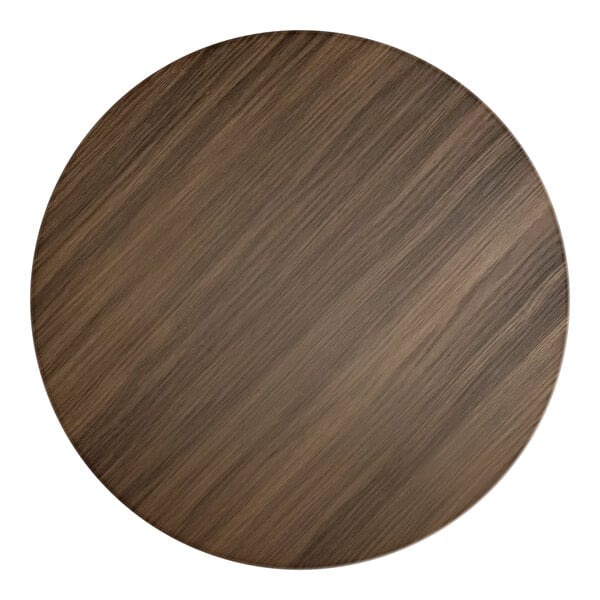 A Lancaster Table & Seating round wood table top with a dark walnut finish.