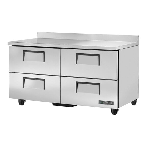 A stainless steel True worktop refrigerator with four drawers.