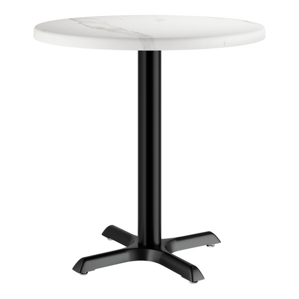 A white marble Lancaster Table & Seating round table with a black base.