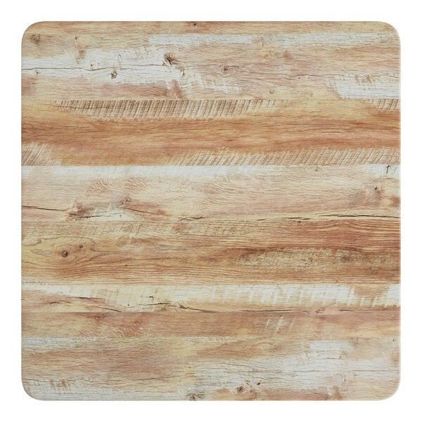 A Lancaster Table & Seating square MDF table top with a barnwood finish.