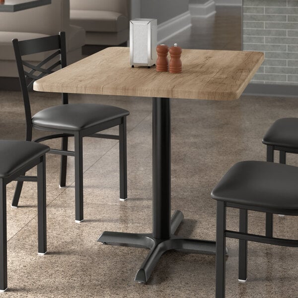 A Lancaster Table & Seating rectangular table with a gray wood finish.
