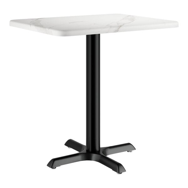 A white rectangular table with a white marble surface and black base.