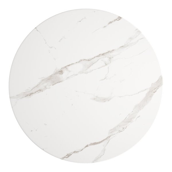 A white marble Lancaster Table & Seating round table top.