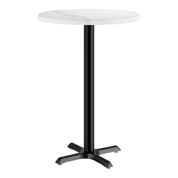 A white table with a black pole and base.