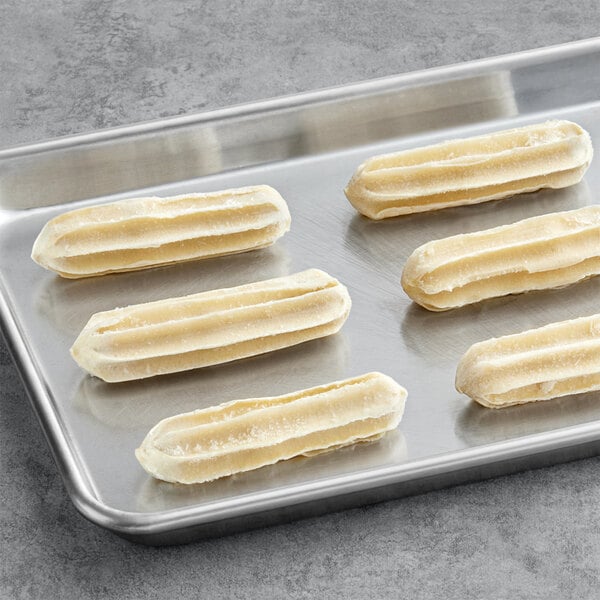 White Toque Chocolate Hazelnut Filled Churros on a tray.