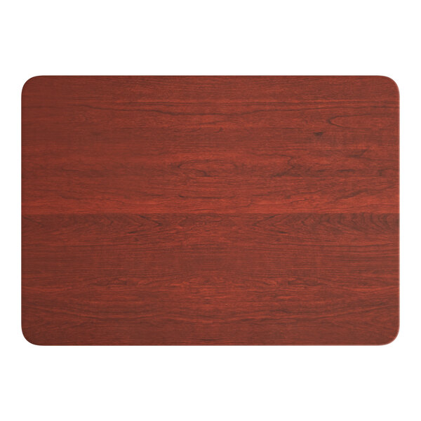 A Lancaster Table & Seating rectangular MDF table top with a red mahogany finish.