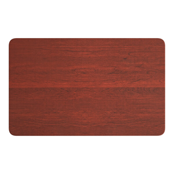 A rectangular wooden table top with a red mahogany finish.