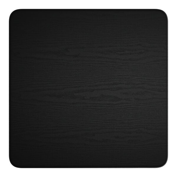 A black square table top with a white center.