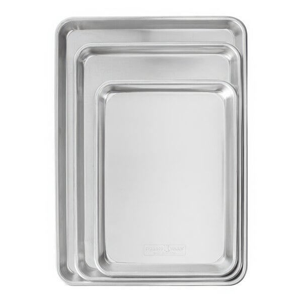 A group of rectangular silver Nordic Ware sheet pans.