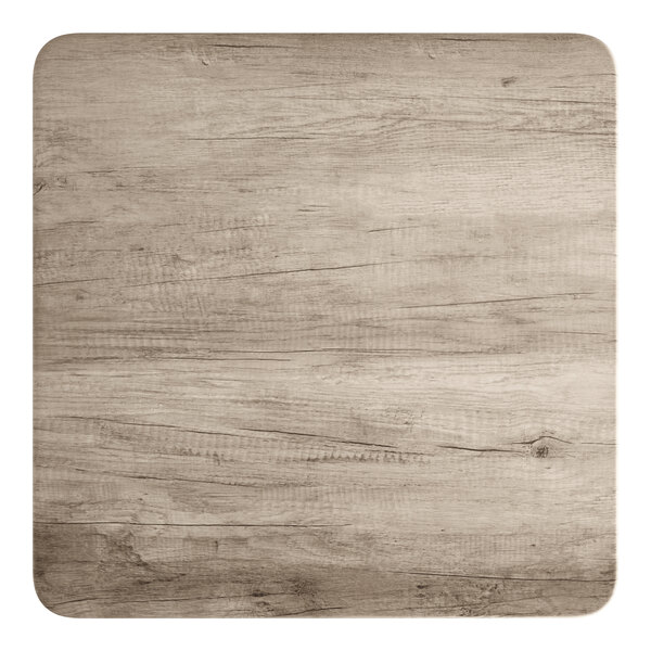 A square standard height table with a gray wood finish and rounded corners.