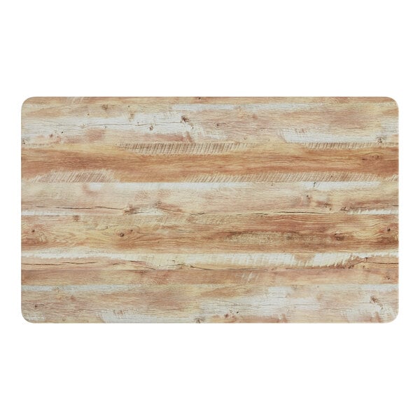 A Lancaster Table & Seating rectangular table top with a barnwood finish.